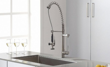 Pull-down kitchen tap over sink